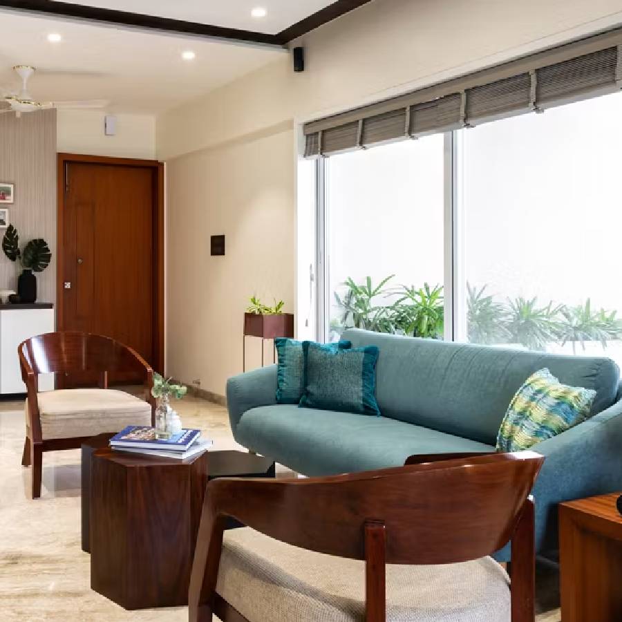 Living Nest Hubs contractors and designers reviewing blueprints with homeowners